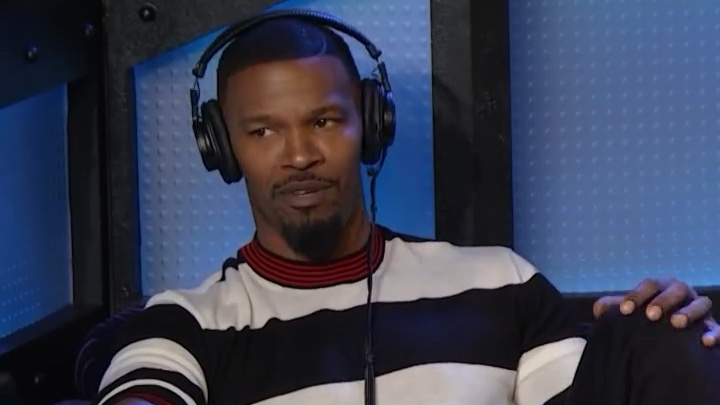 Jamie Foxx wearing headphones during his Stern Show interview