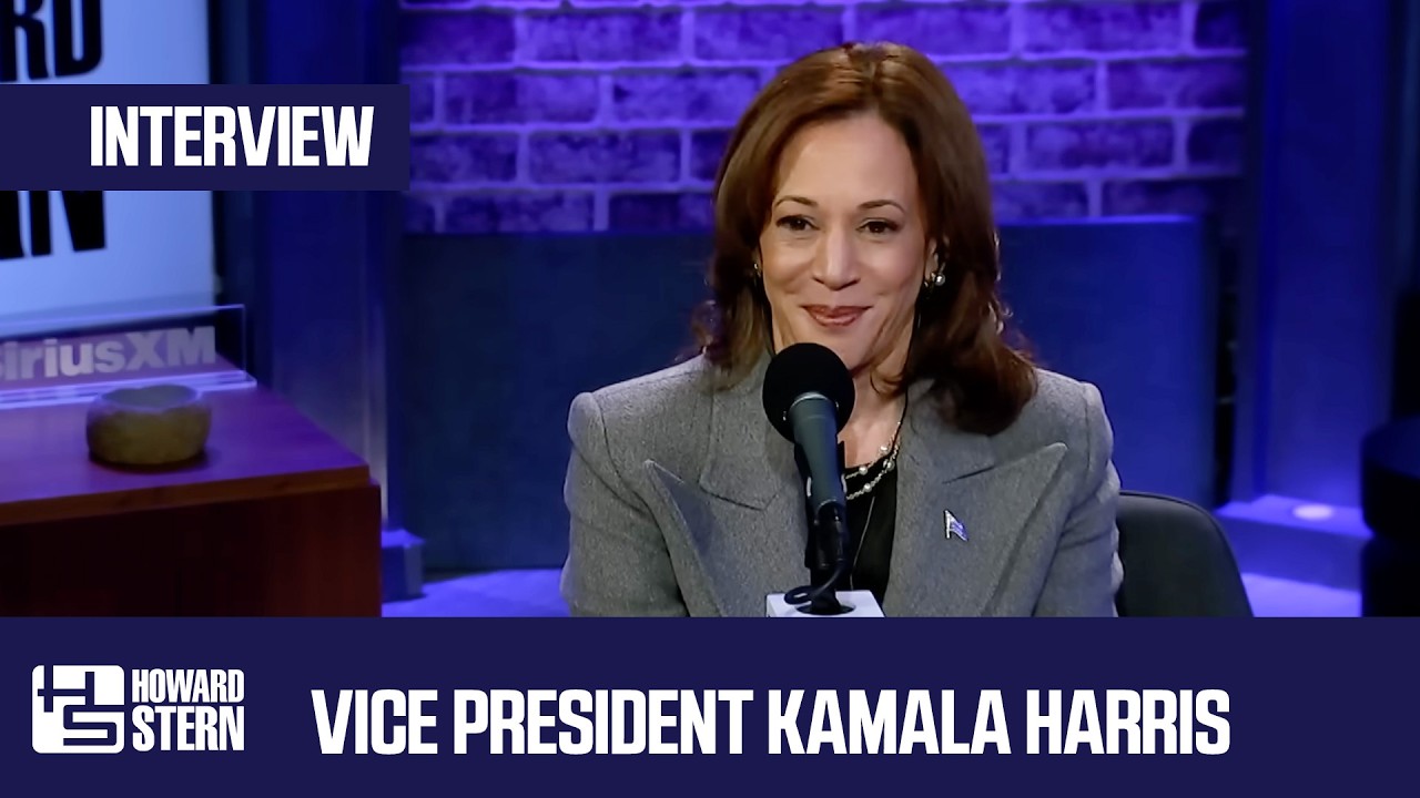 Vice President Kamala Harris speaking into a microphone during her Howard Stern Show interview